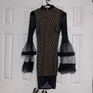 Bodycon black and nude dress. Women’s size small. Cover inside dress.